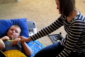 Max Watson, with mom Deana, doing musical therapy